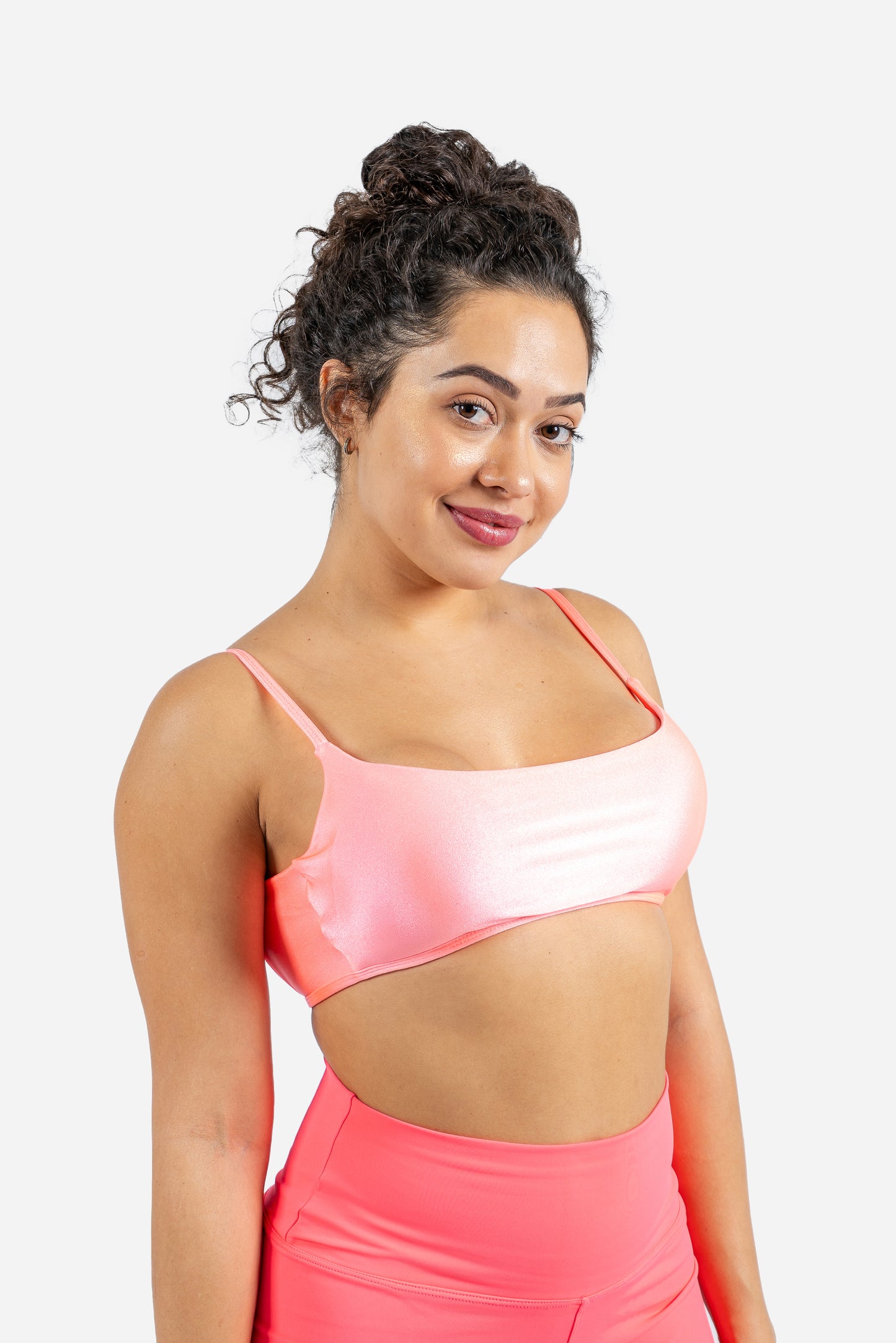 Thayane wearing Luxe Flow Curve Bra in Neon Pink – sculpted silhouette front view