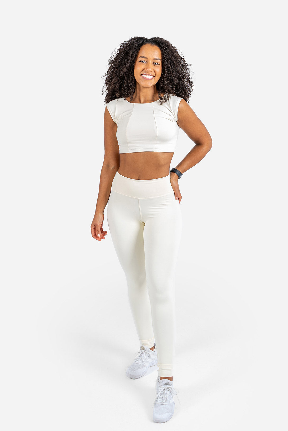 Woman wearing a white outfit on a white background